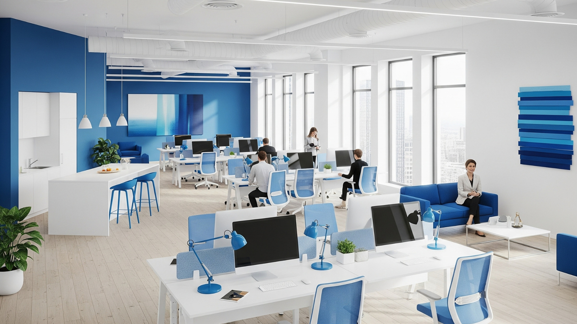 Blue and white workplace with different workstations and a mini kitchen