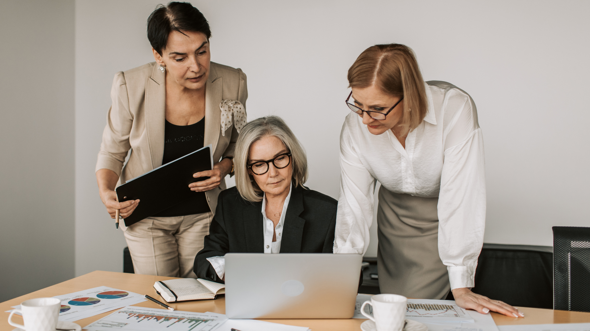 Debt collectors looking at some work together in the office